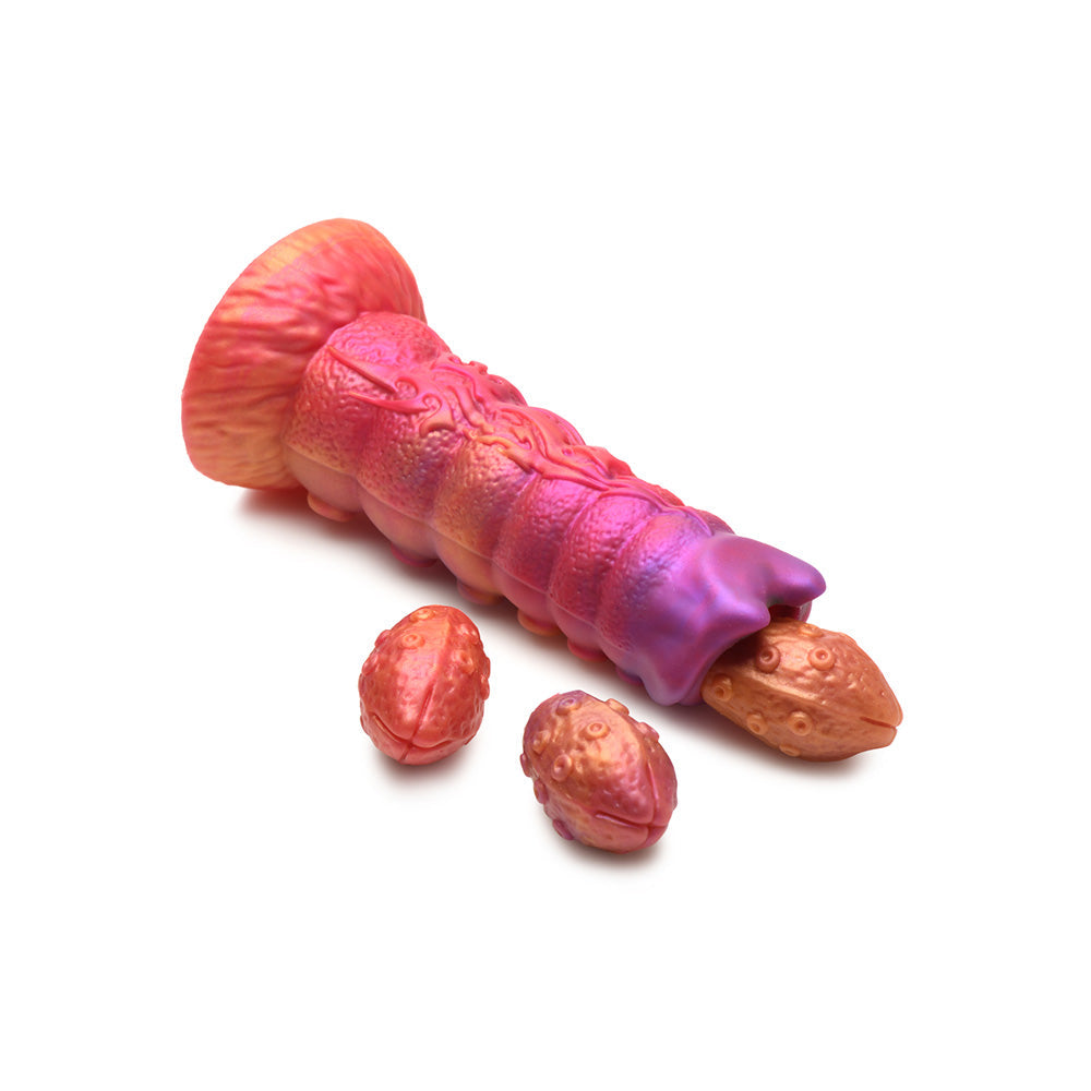Pink and purple segmented dildo with three egg-shaped attachments.