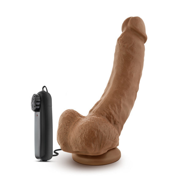 9-inch tan realistic vibrating dildo with suction cup base and black remote.
