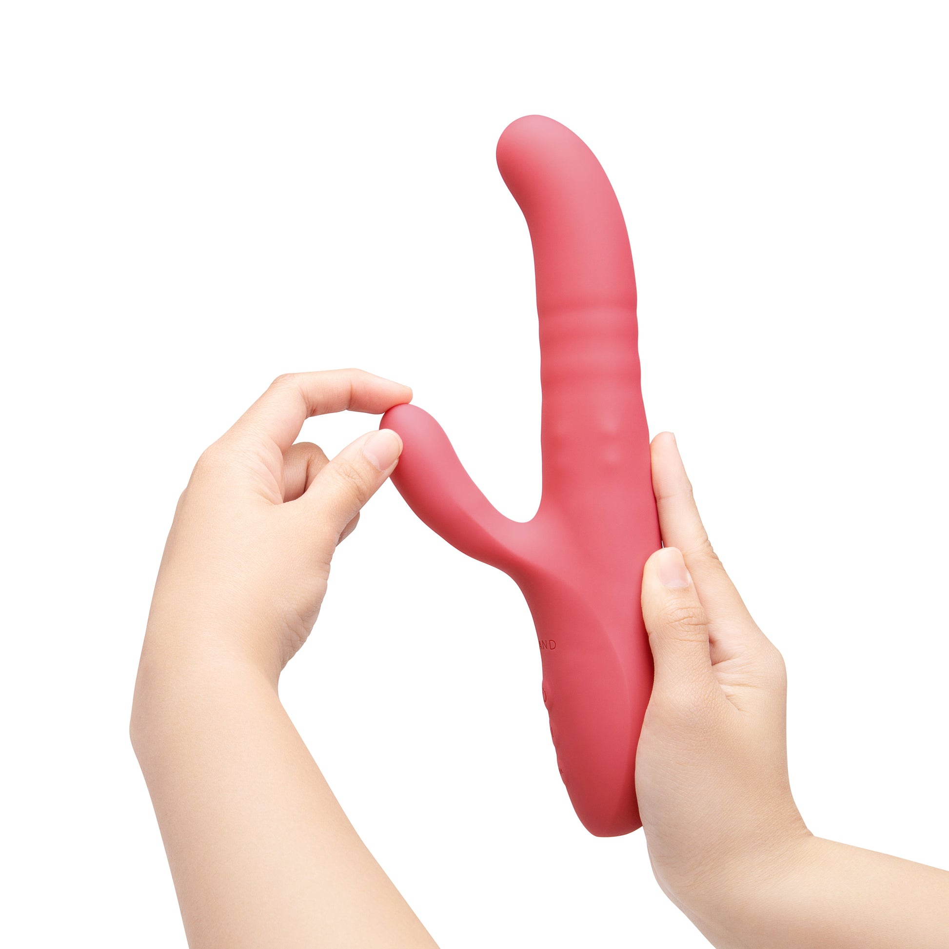 A pink rabbit vibrator with two hands holding it.