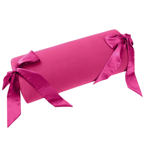 Pink bolster pillow with satin sashes on each end.