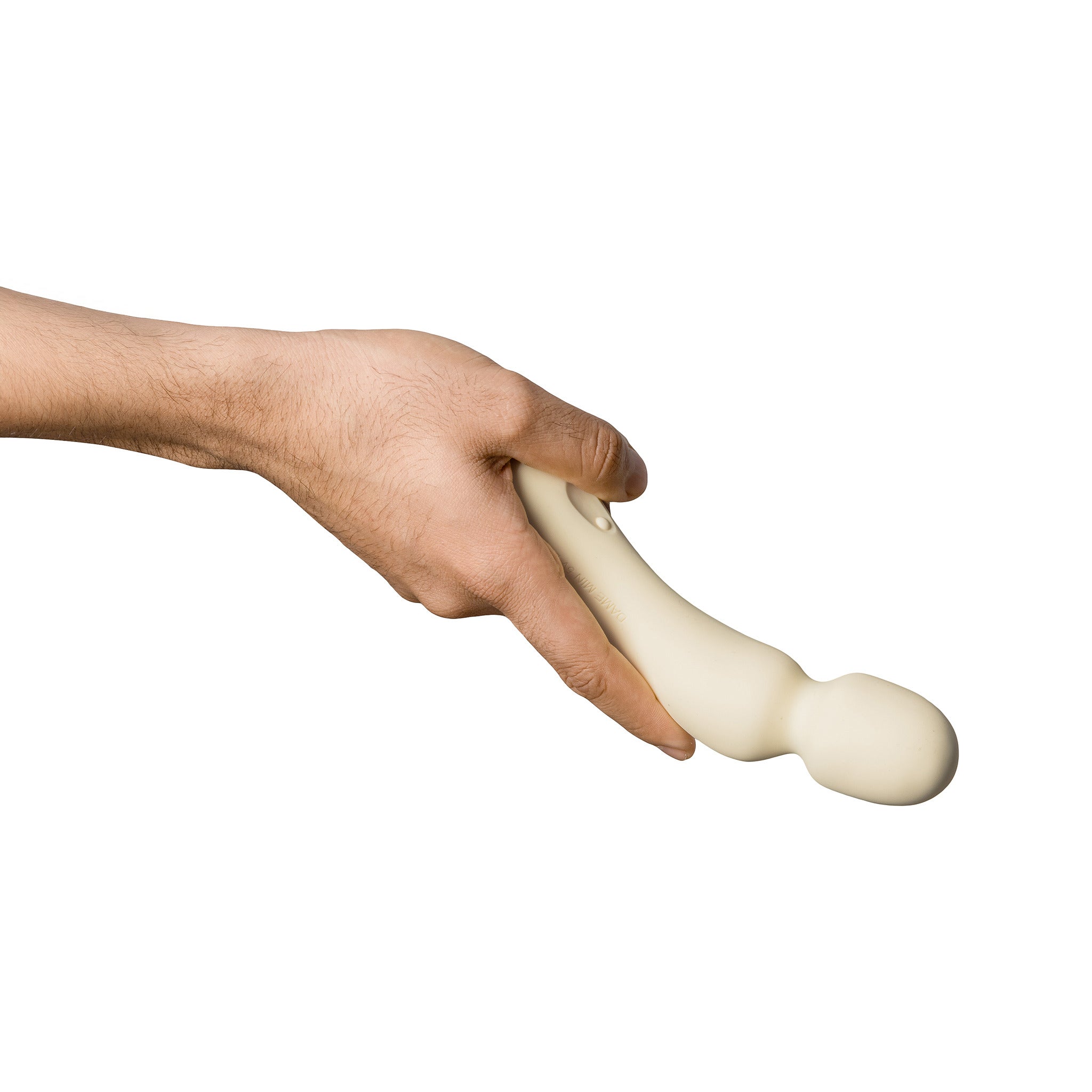 A hand holds a beige silicone wand vibrator.