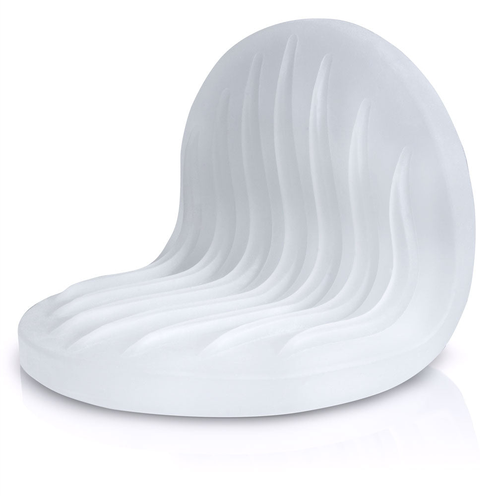 White textured stroker pad with a curved, wavy design.