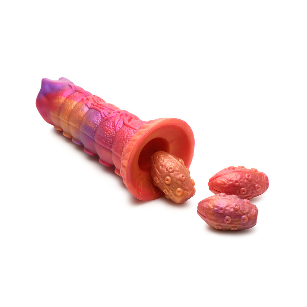 Silicone dildo with segmented ribs and three textured eggs.