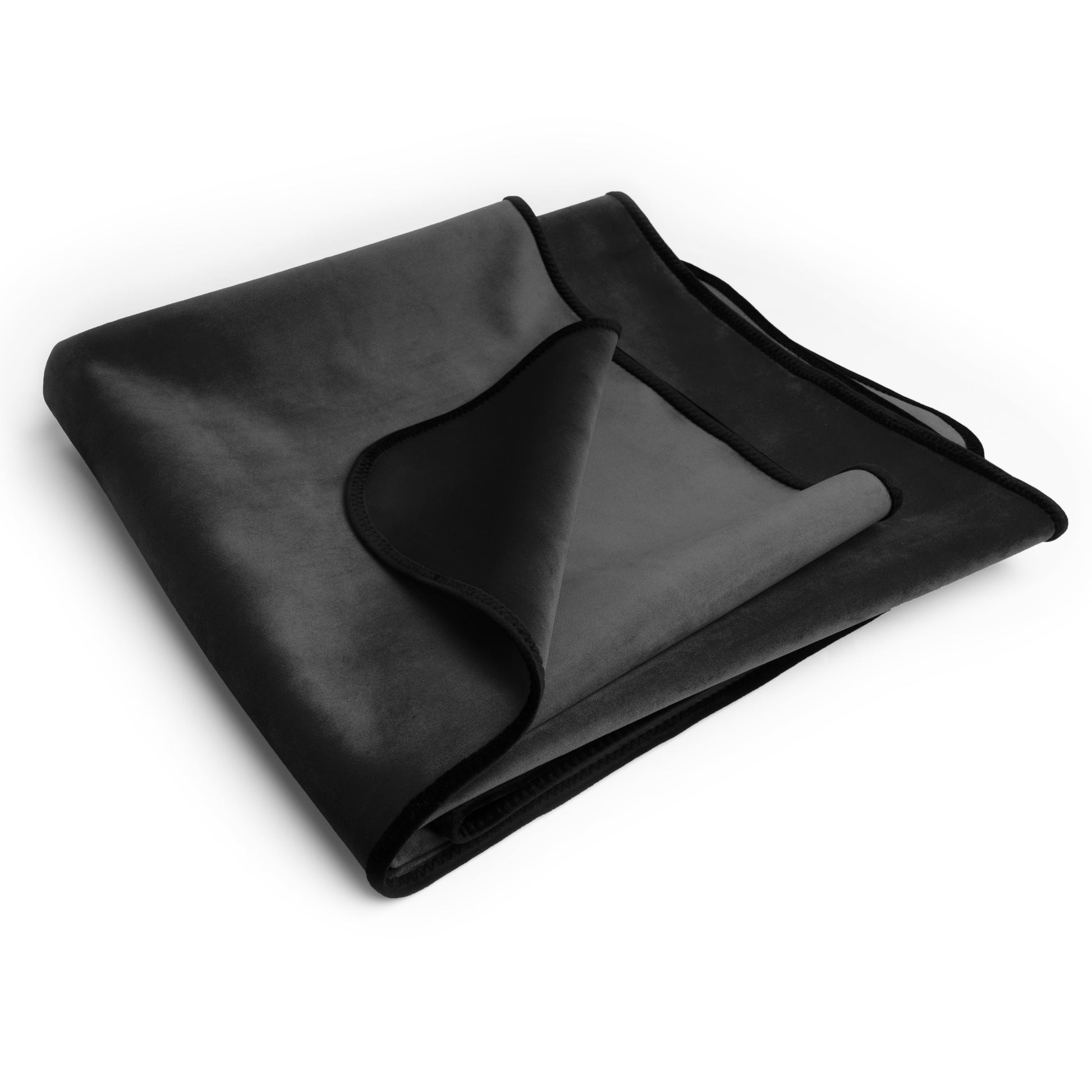 A black waterproof microvelvet blanket folded on a white background.