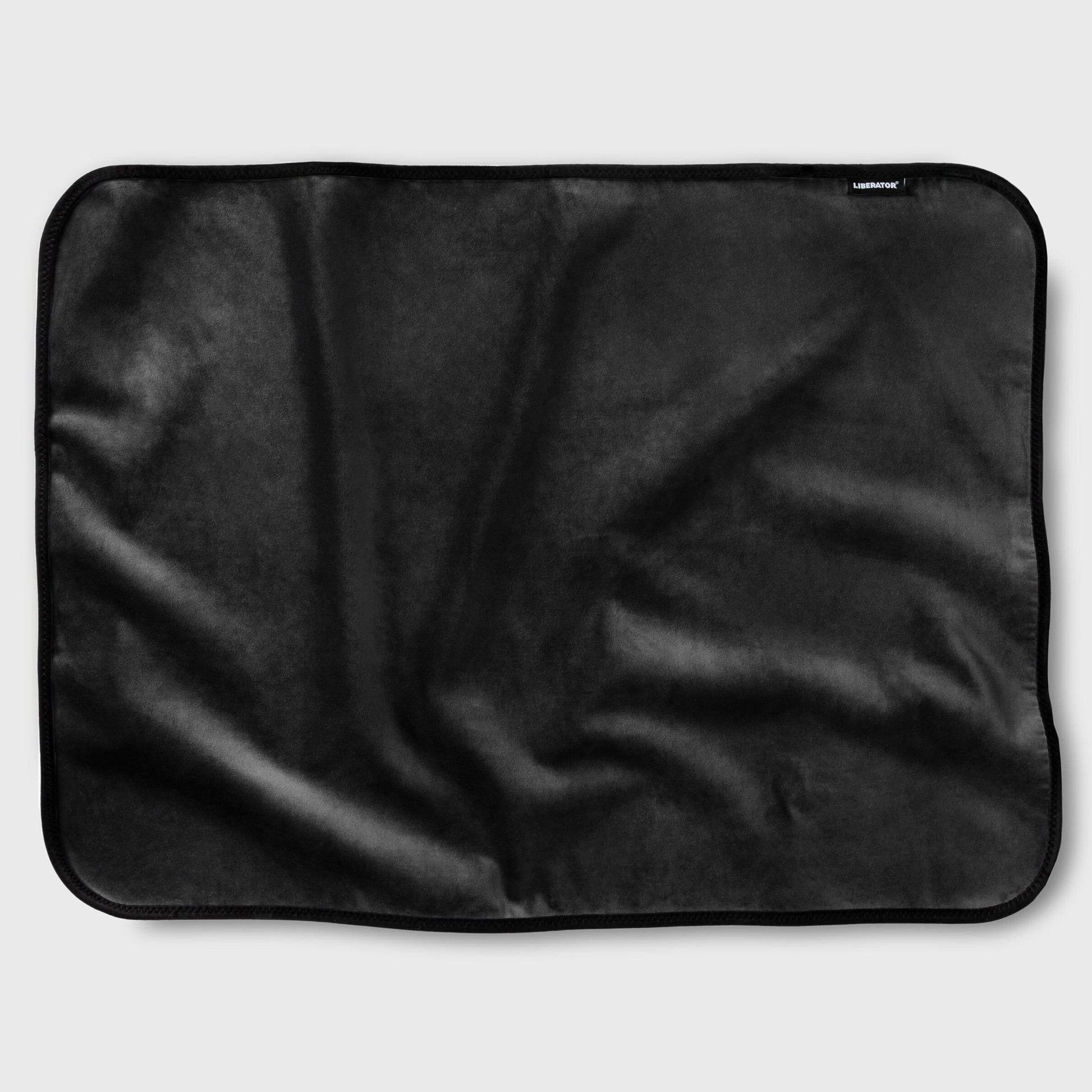 A black waterproof microvelvet sex throw with a stitched edge.