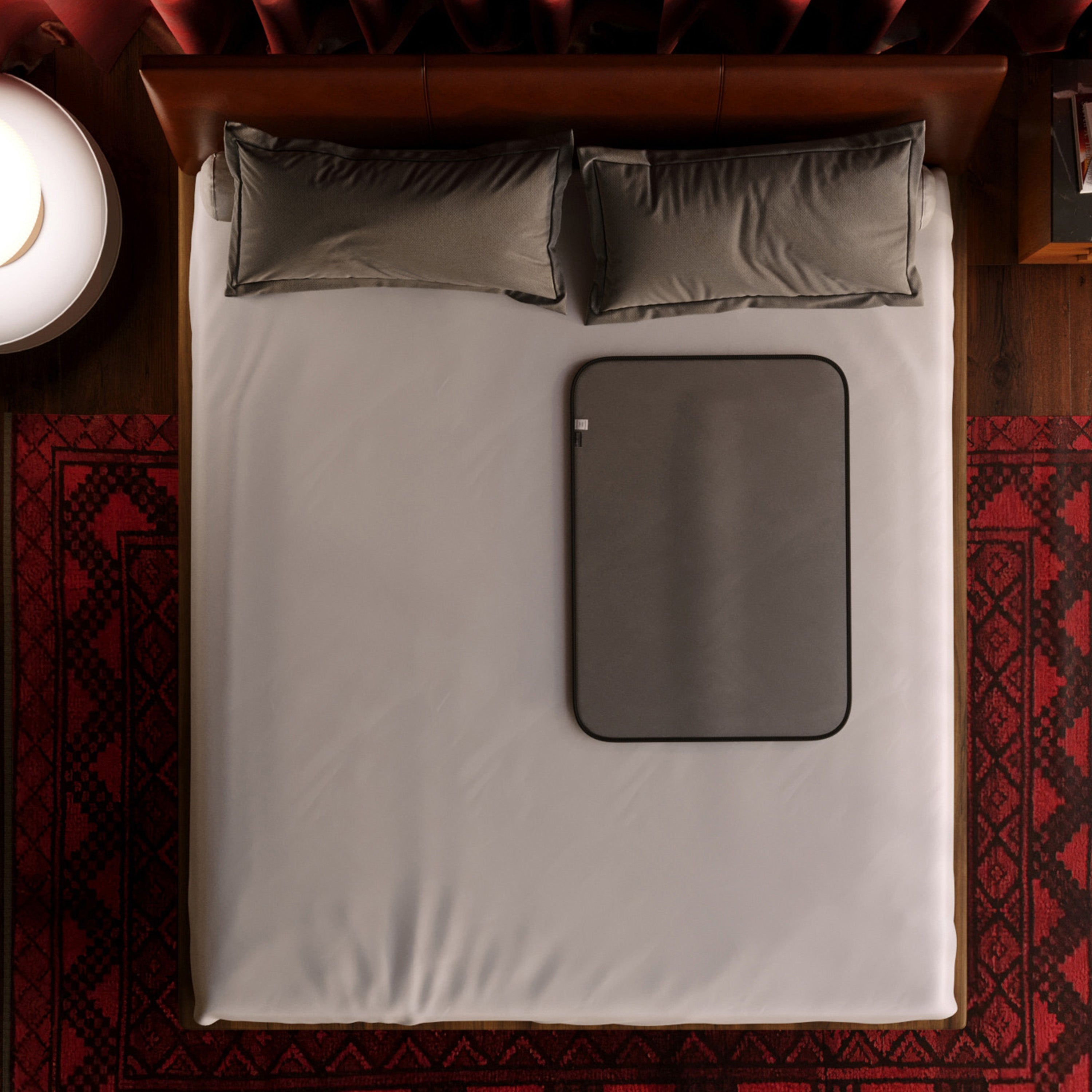 Grey microvelvet waterproof sex throw blanket on a bed.
