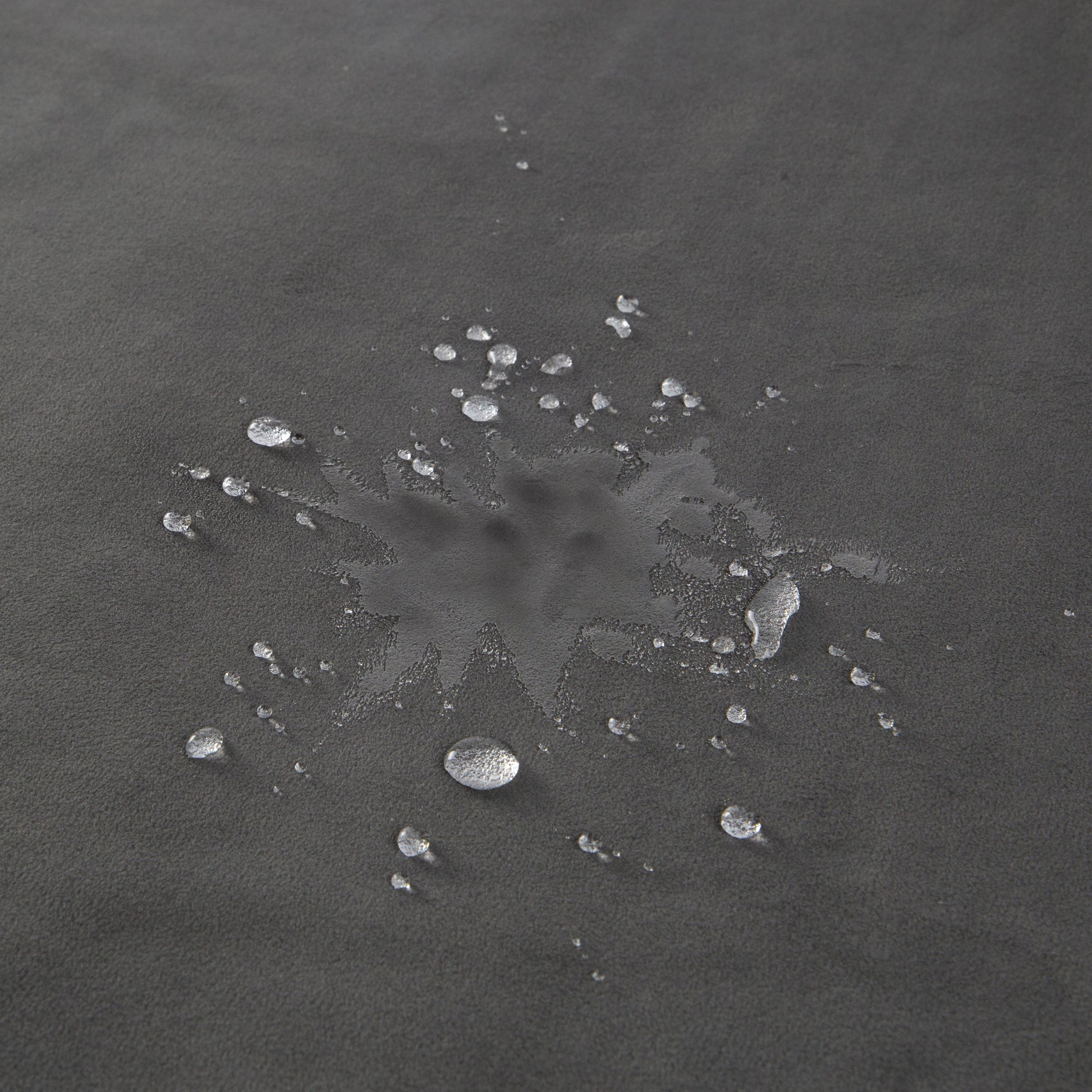 Grey waterproof microvelvet sex throw with water droplets.