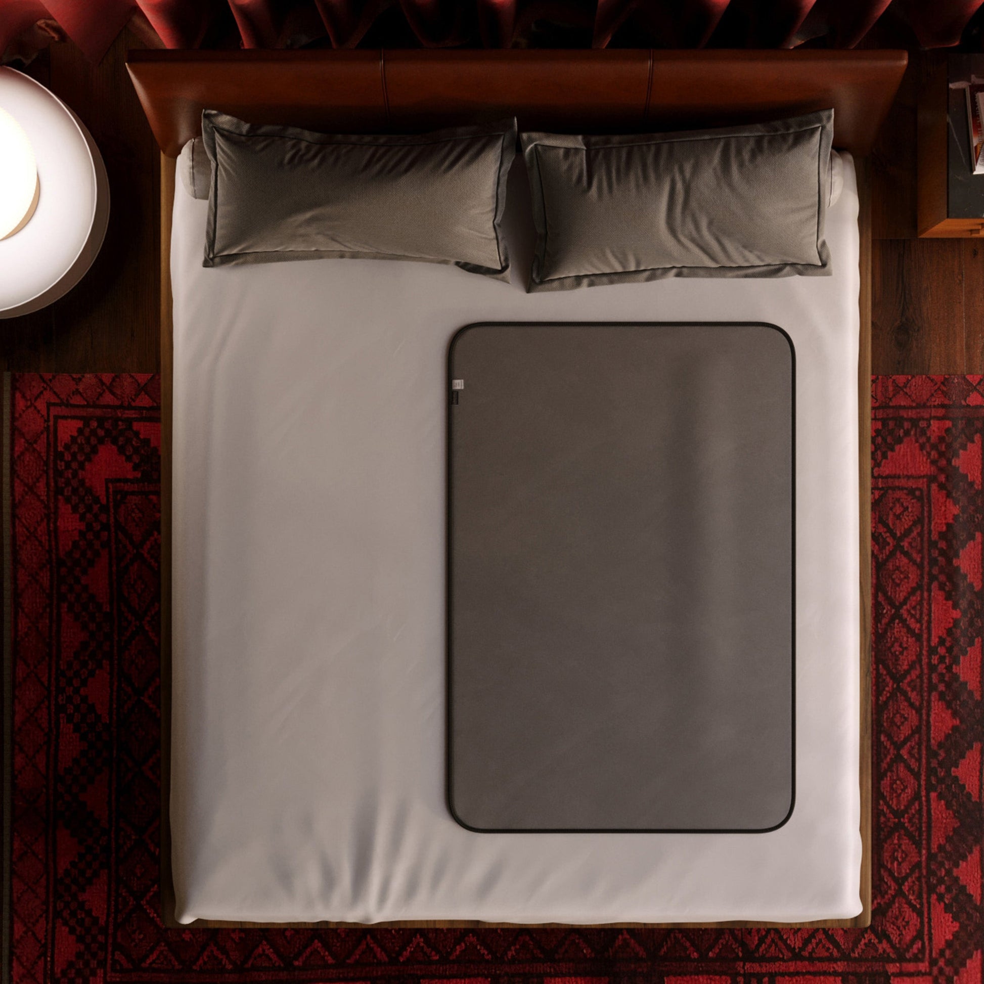 Grey waterproof microvelvet sex throw on a bed.
