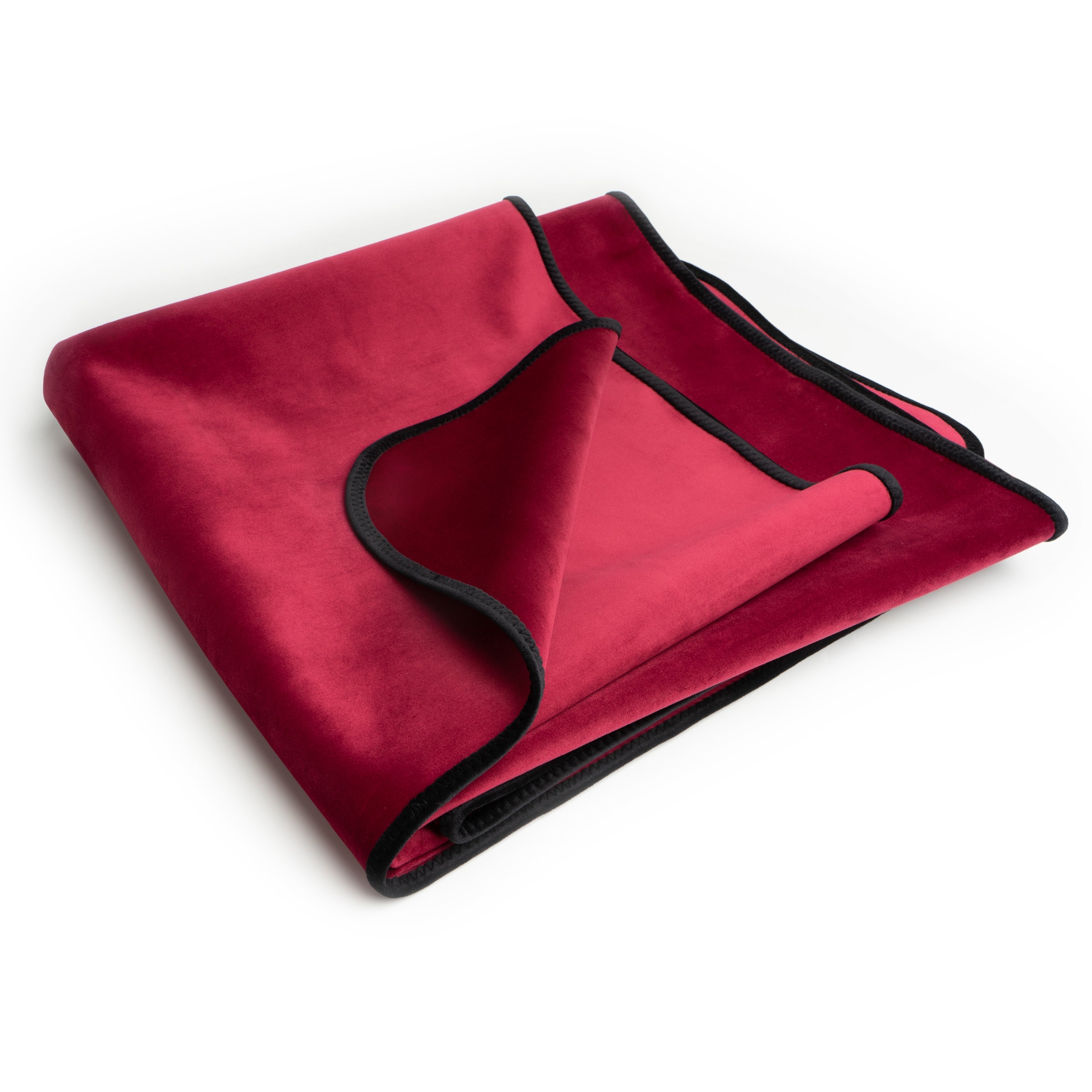 A folded merlot colored waterproof microvelvet throw with black trim.