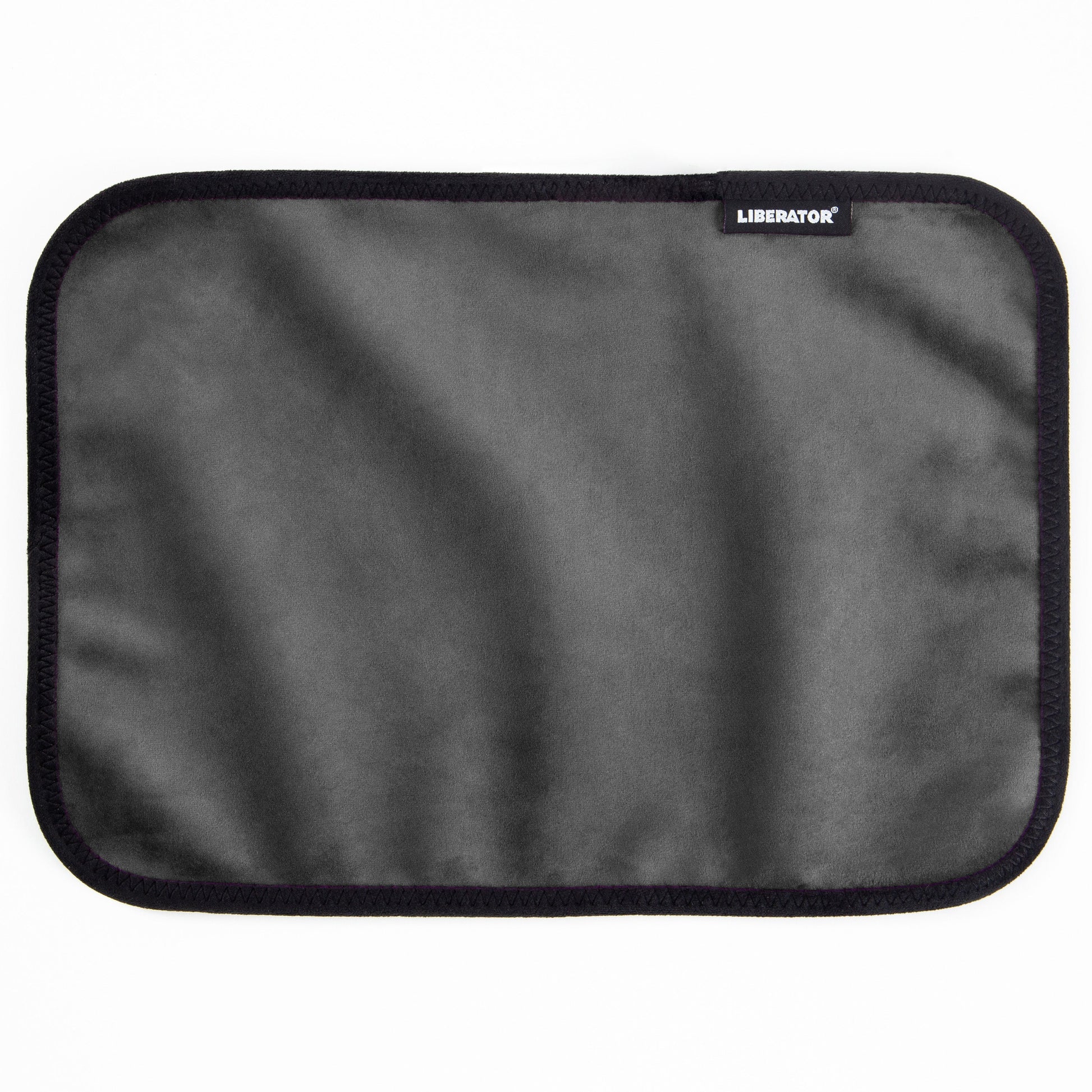 A gray moisture-proof toy pad with a black stitched border and the Liberator logo.