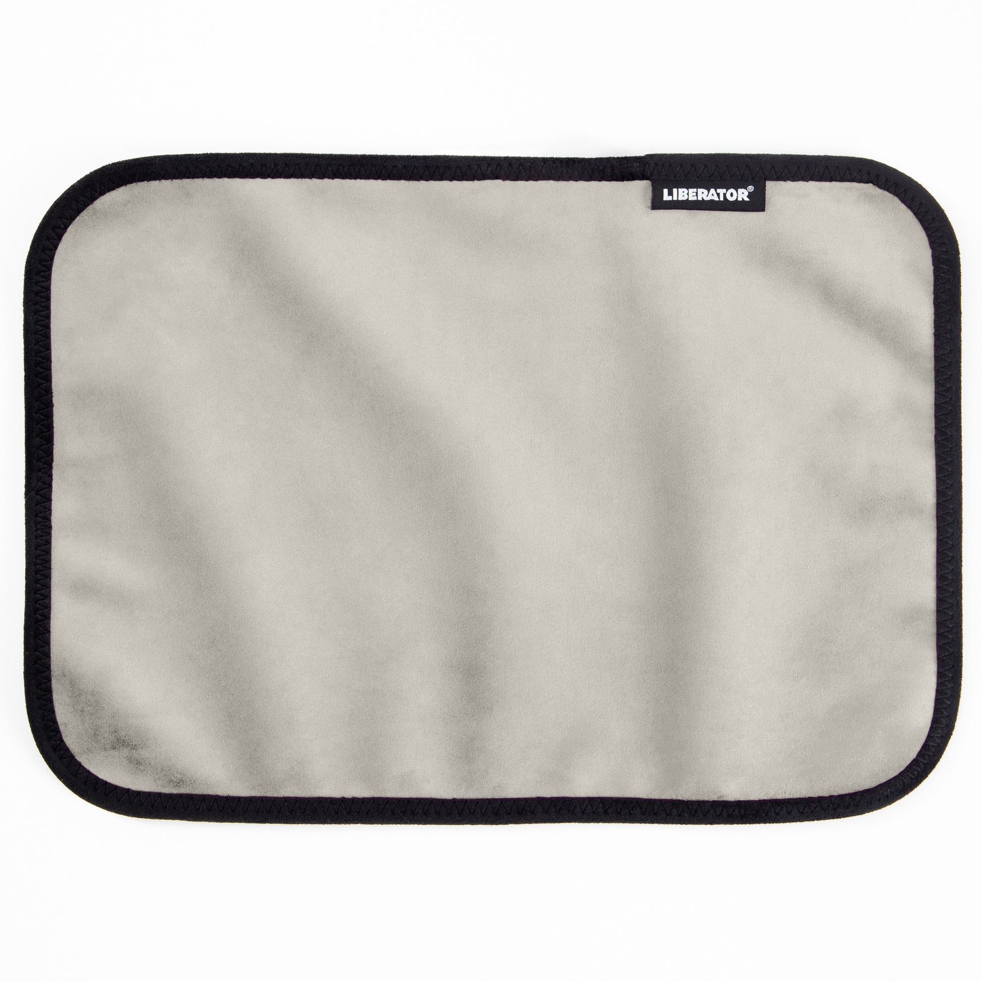 A rectangular grey microvelvet pad with a black stitched border and a Liberator logo.