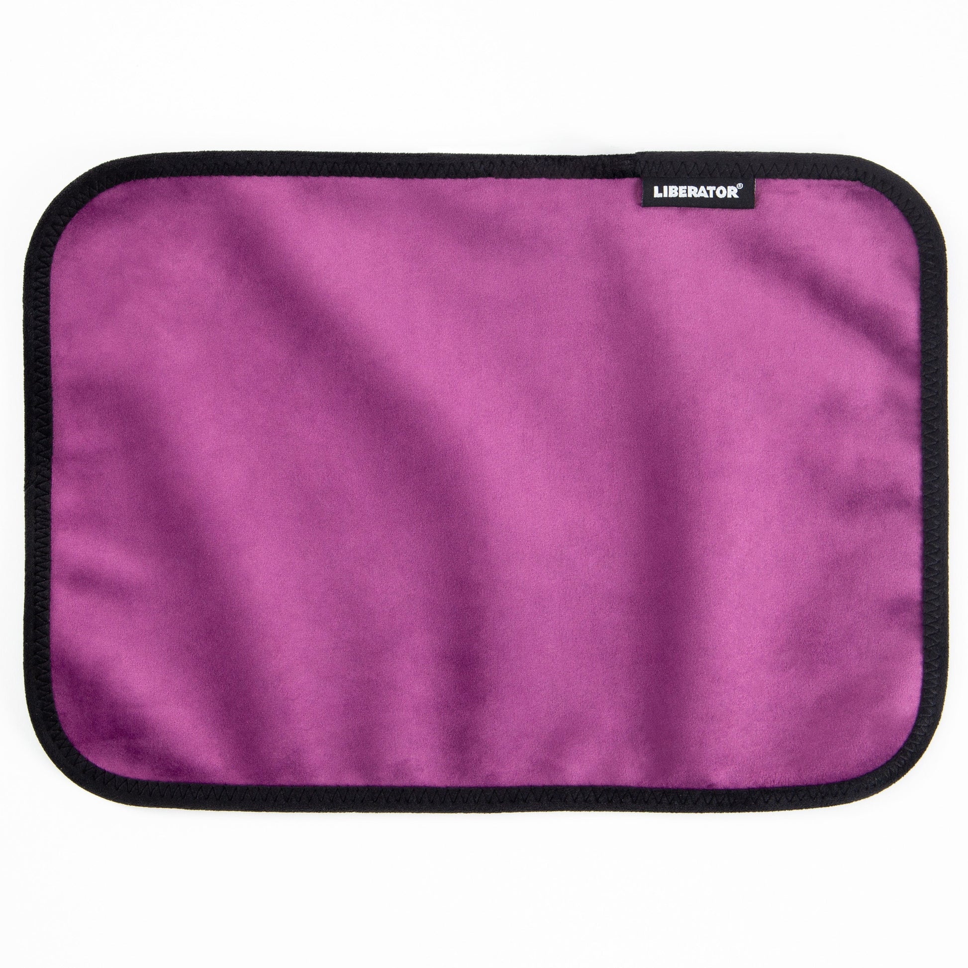 Moisture-proof aubergine microvelvet toy pad with black trim and a Liberator logo.