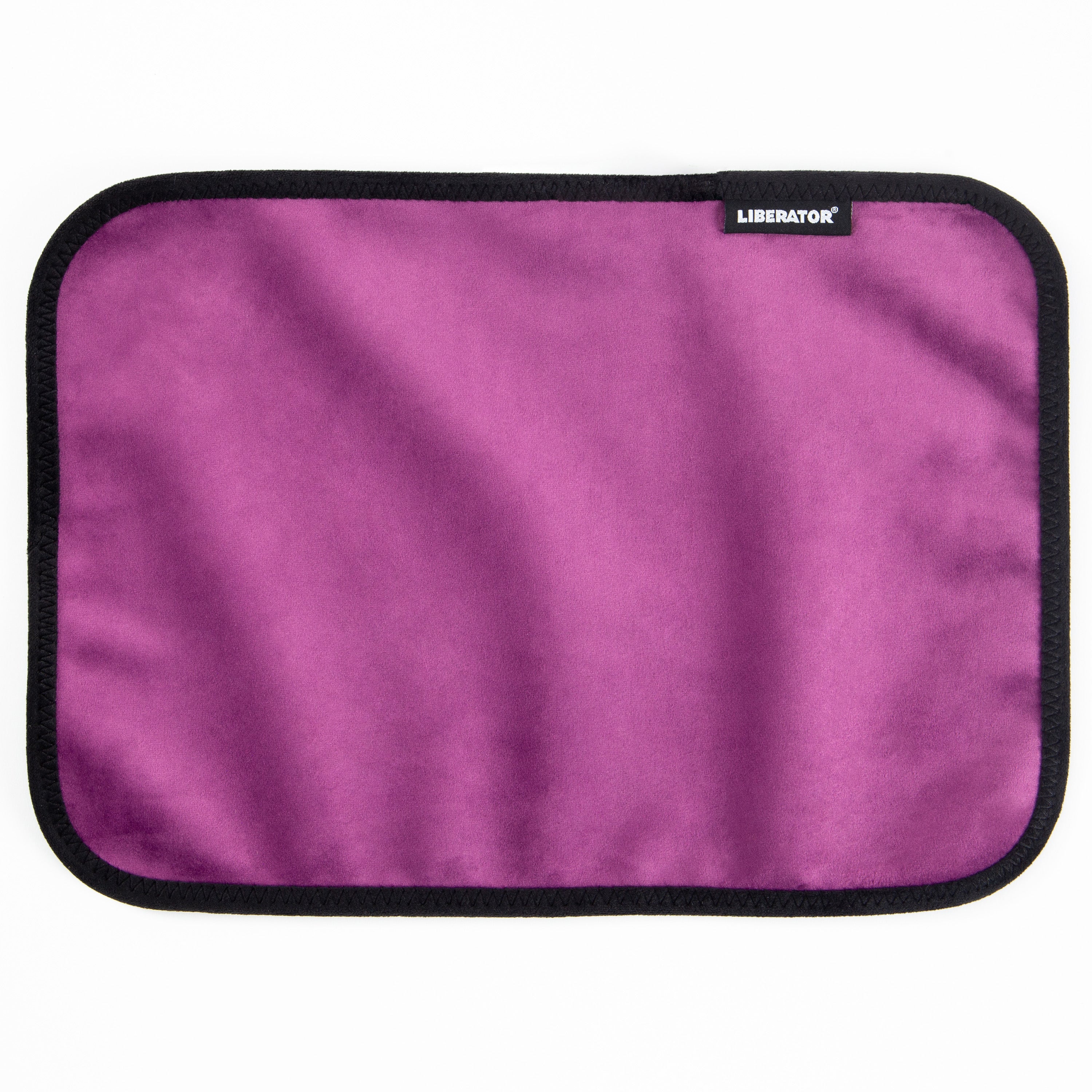 Moisture-proof aubergine microvelvet toy pad with black trim and a Liberator logo.