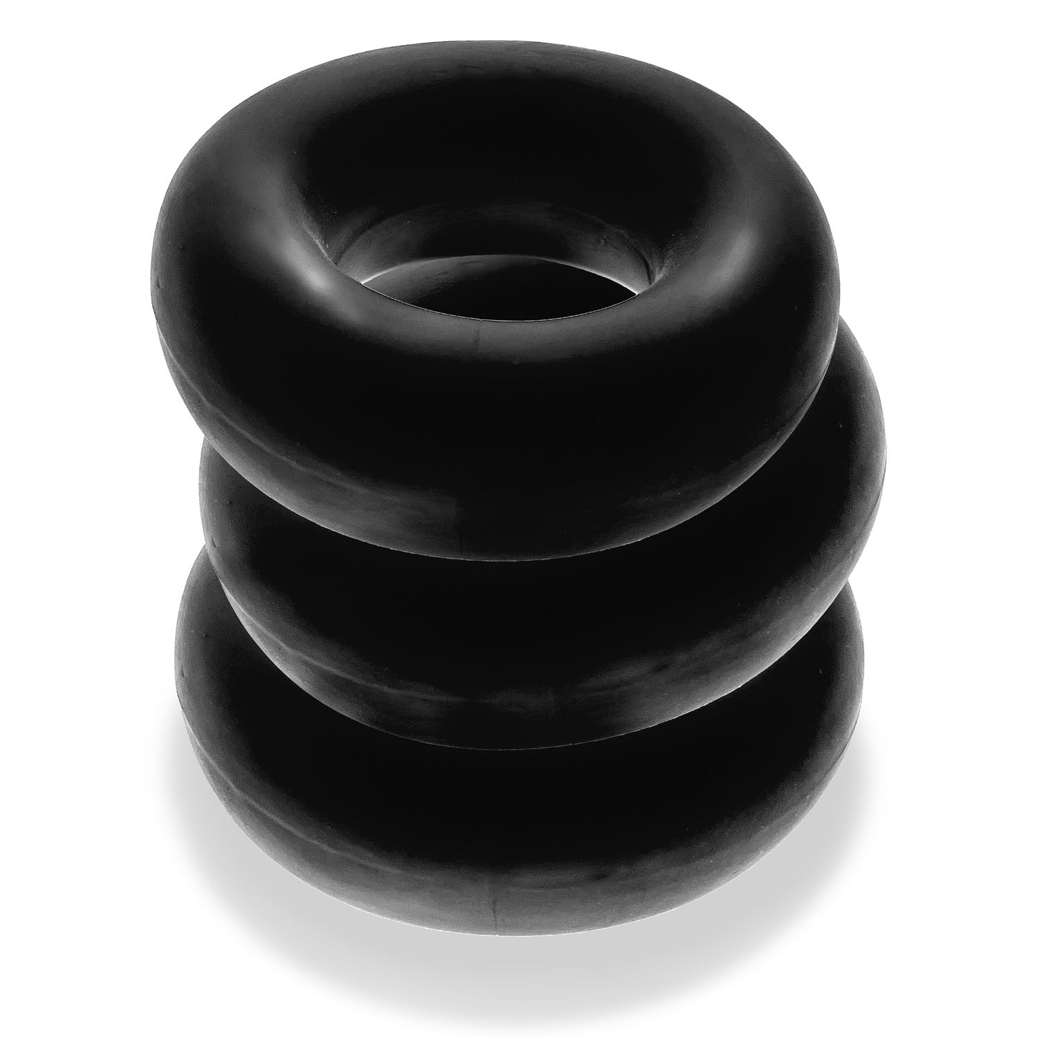 Three black stretchy cock rings stacked on top of each other.