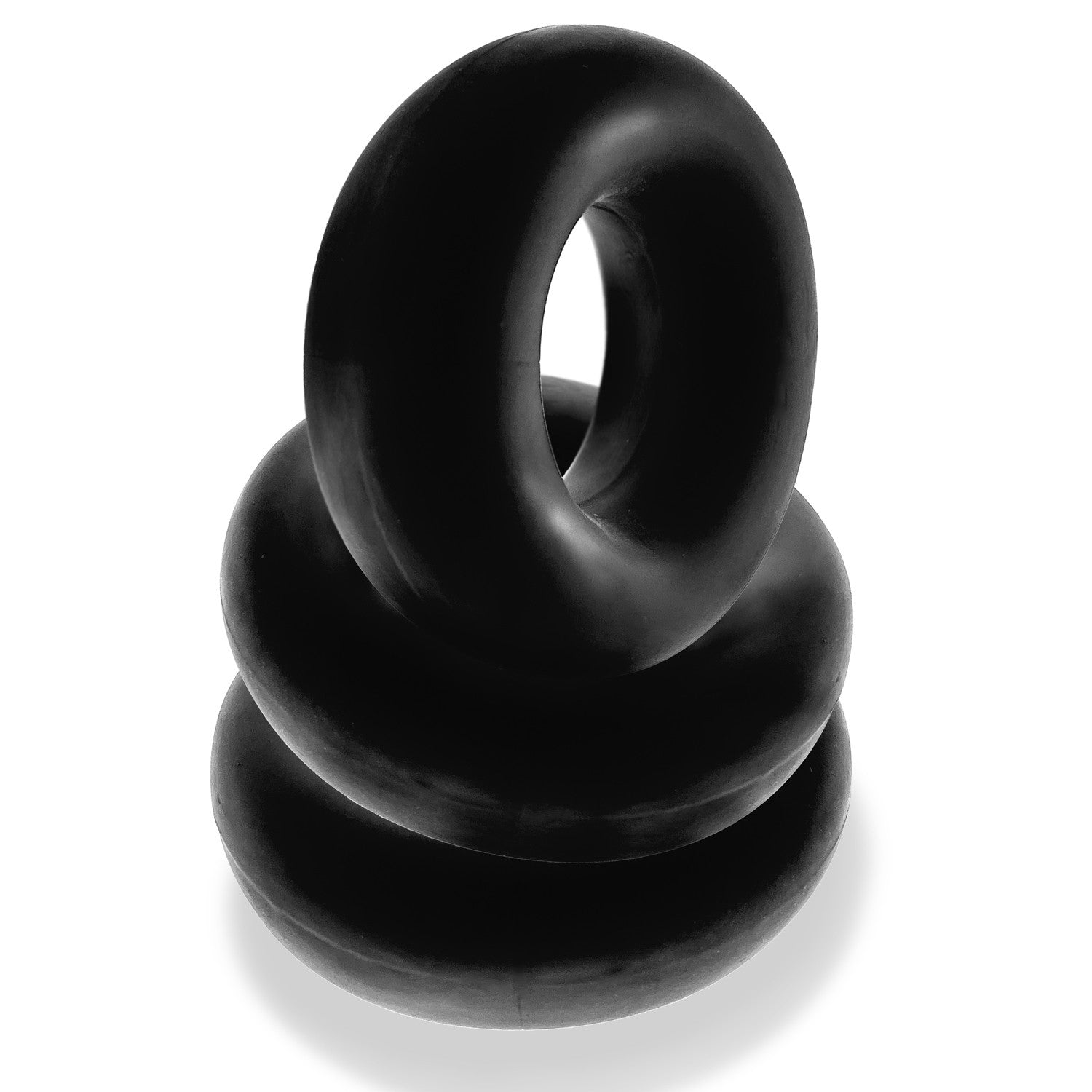 Three black, stretchy cock rings stacked on a white background.