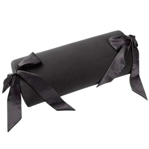 Black microvelvet bolster pillow with silk sashes.