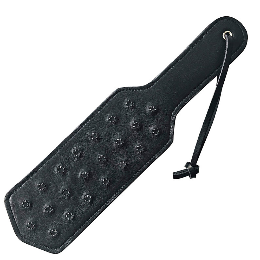 Black leather paddle with metal spikes and a wrist strap.
