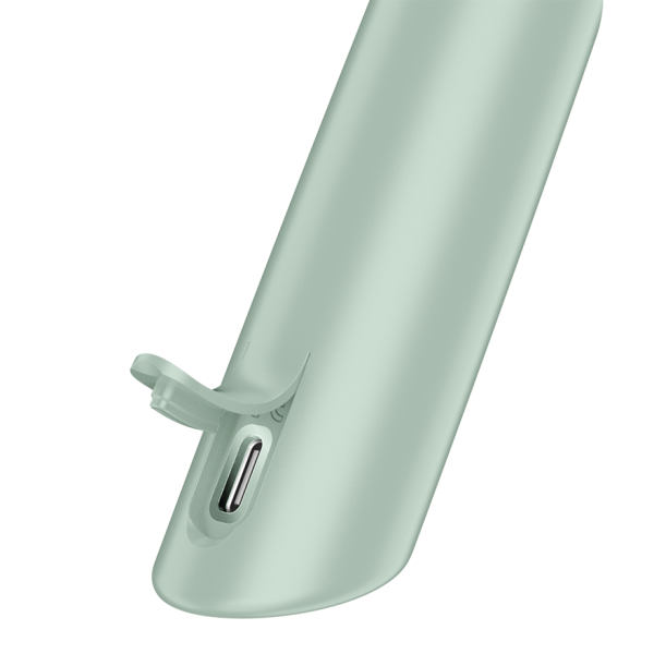 Close-up of a light green vibrator with a USB-C port.