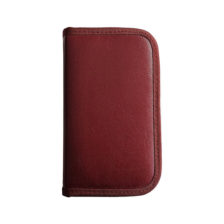 A burgundy case with a textured surface and a woven edge.