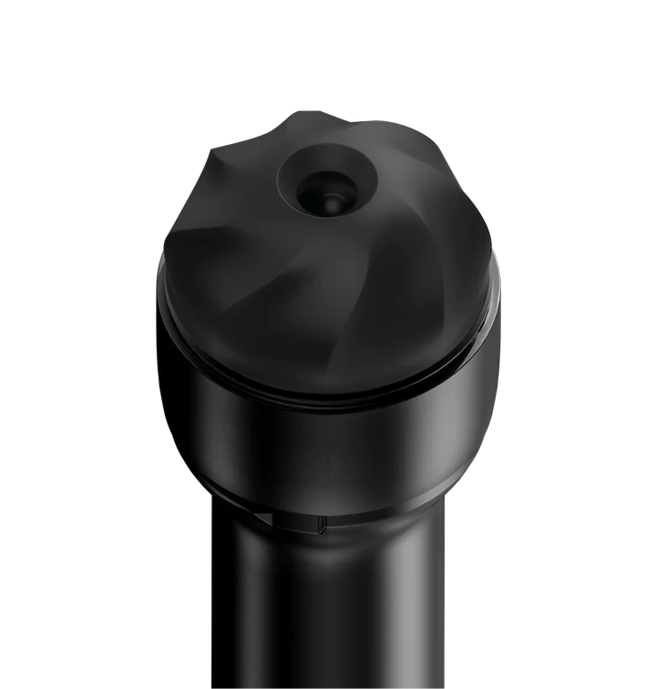 Black TPE stroker sleeve with a textured opening.