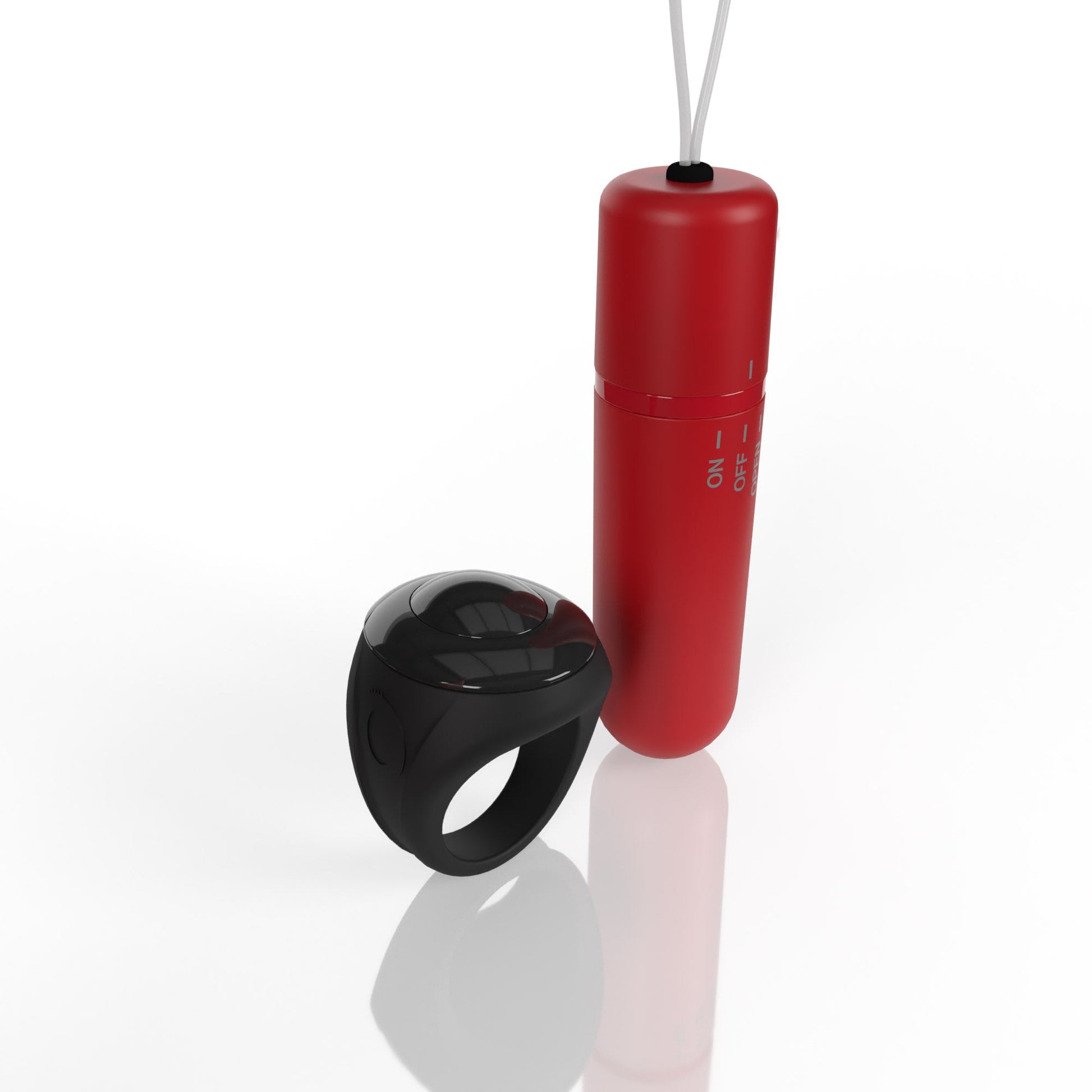 A black ring vibrator and a red remote control vibrator on a white background.