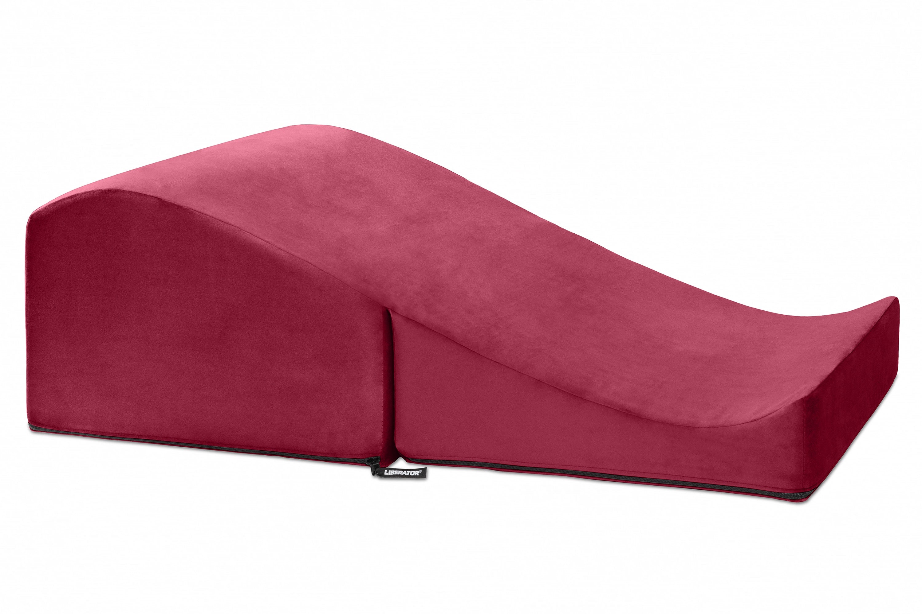 A red Liberator Flip Ramp sex positioning pillow and ottoman.