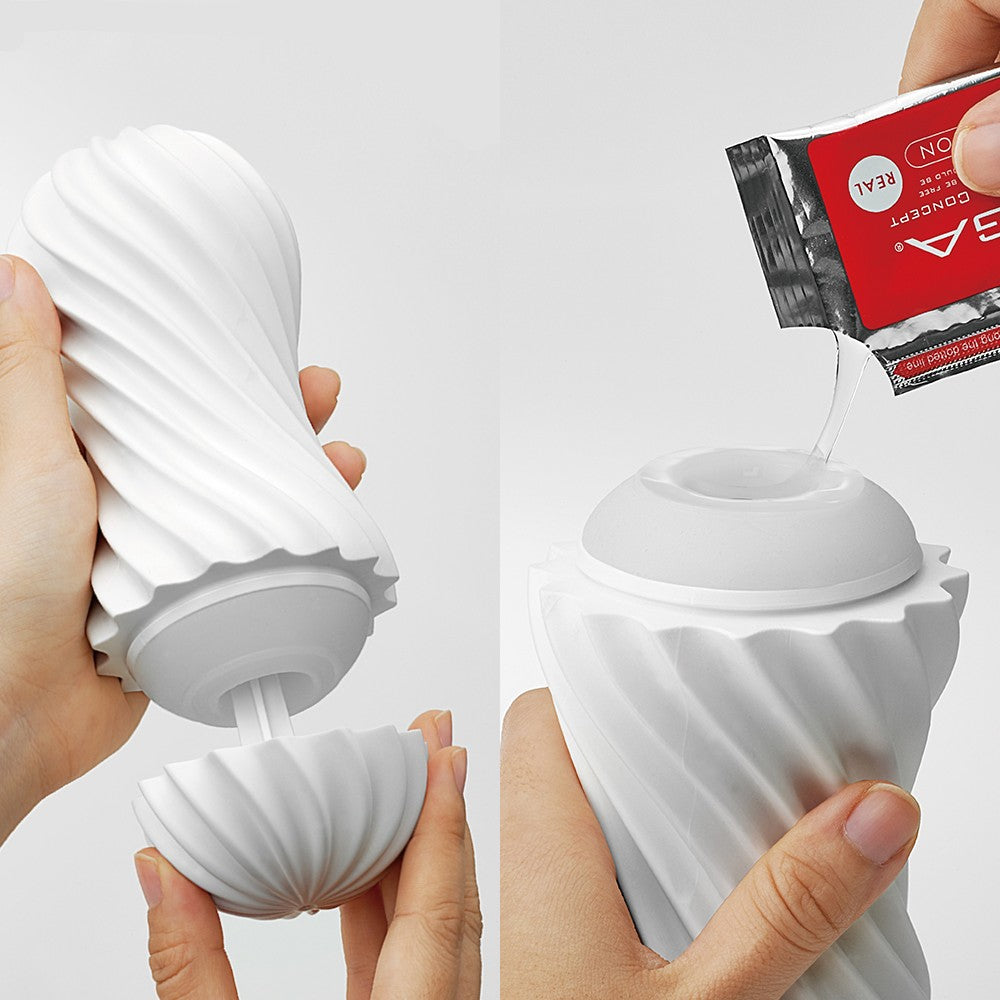 A white spiral stroker is shown being filled with lubricant from a packet.