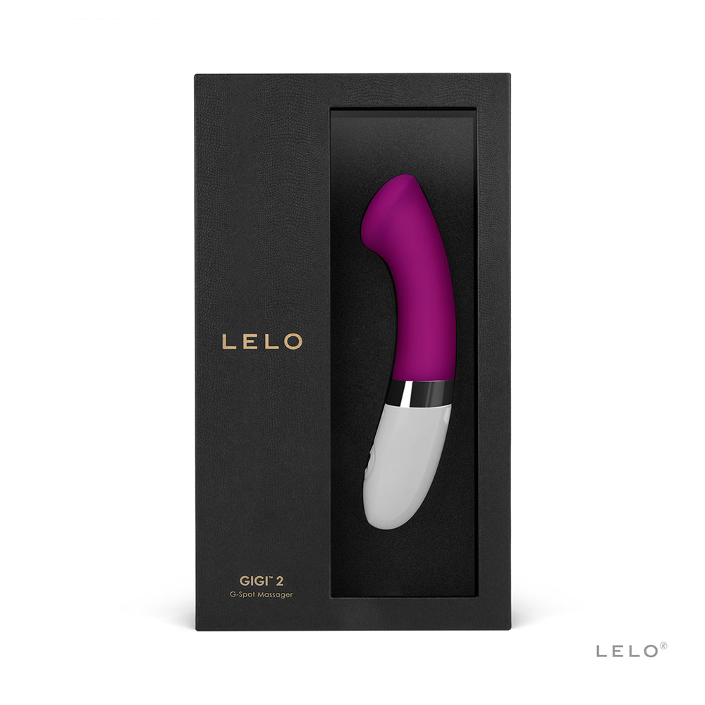 A deep rose G-Spot vibrator with a white base, displayed in a black box.