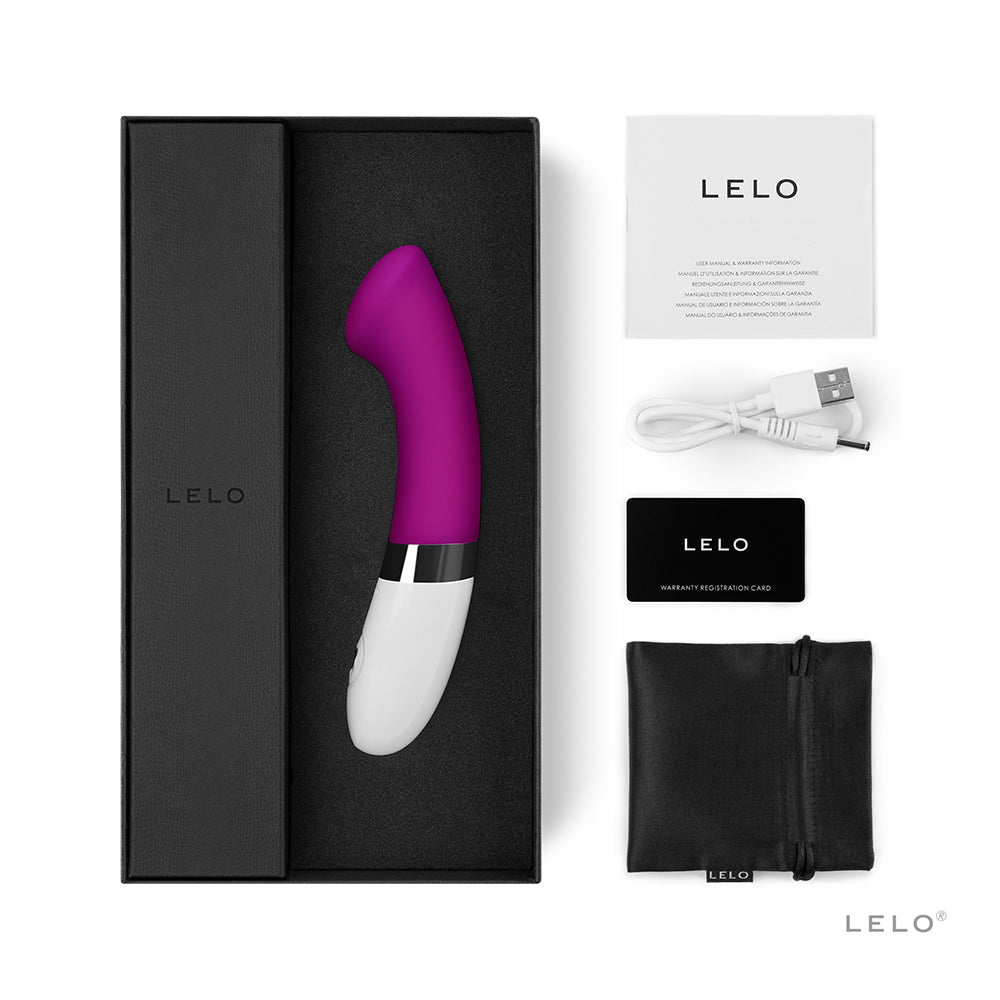 A deep rose G-spot vibrator with a charging cable, warranty card, and storage pouch.