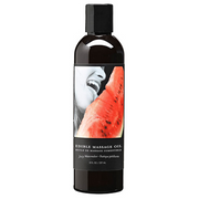 Bottle of Watermelon Edible Massage Oil with a slice of watermelon and a person's mouth on the label.