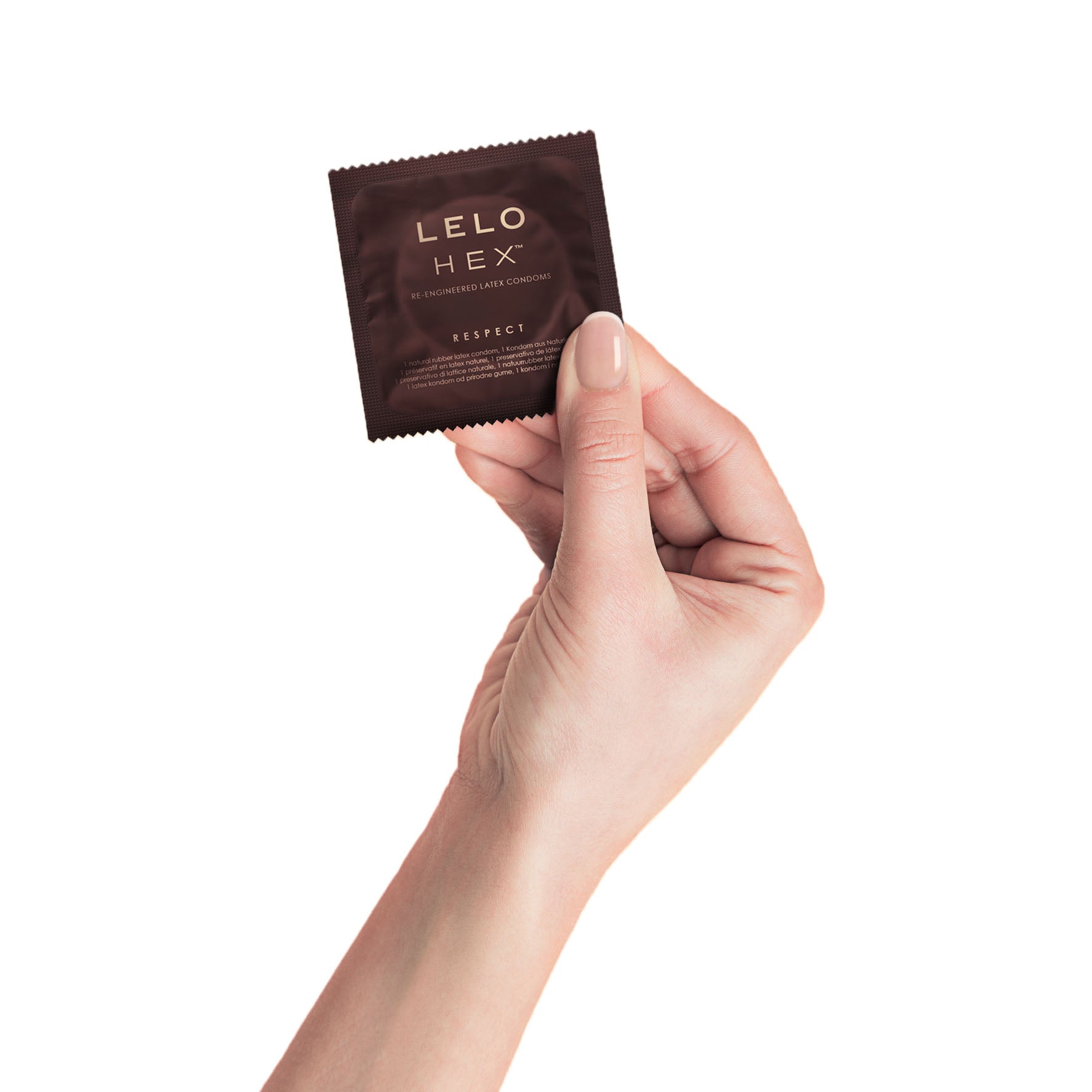 A hand holds a single Lelo HEX Respect XL condom wrapper.