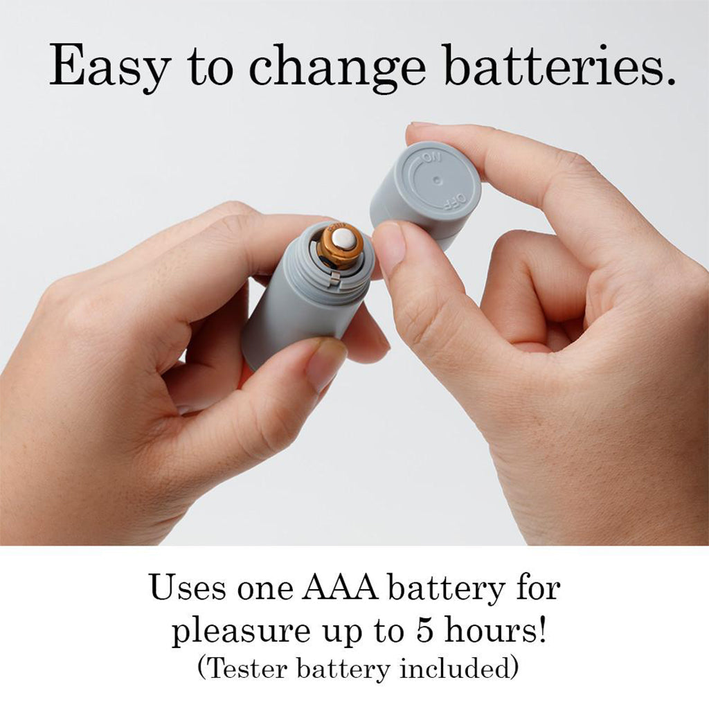 Hands changing a AAA battery in a lilac personal massager.