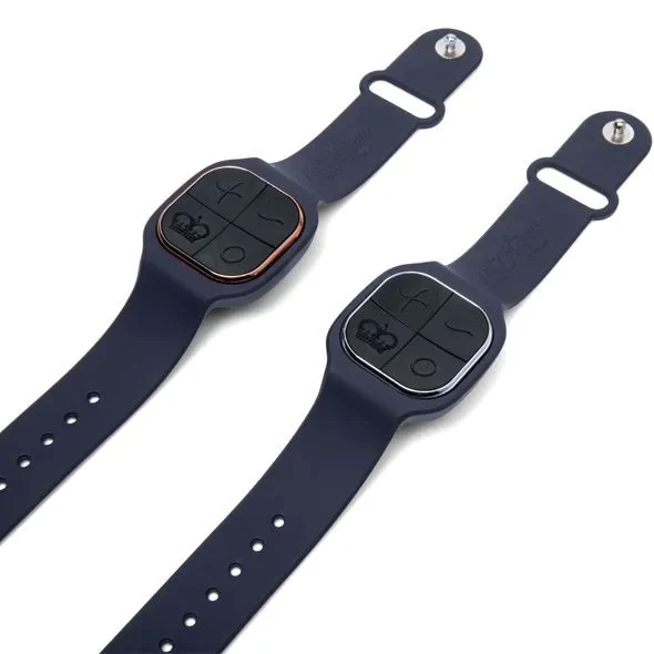 Two navy blue couples vibrators with wrist remotes and crown symbols.