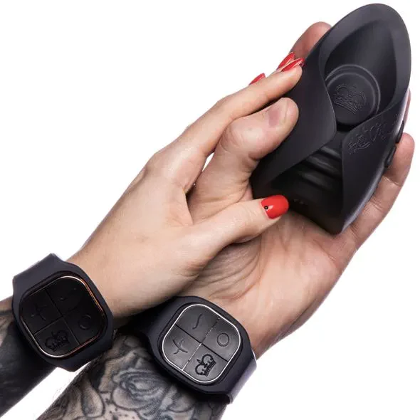 Couples vibrator with two wrist remotes and a black silicone toy.