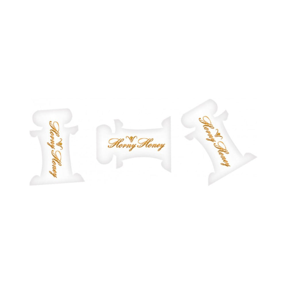 Three white pillow packs with gold "Horny Honey" text.