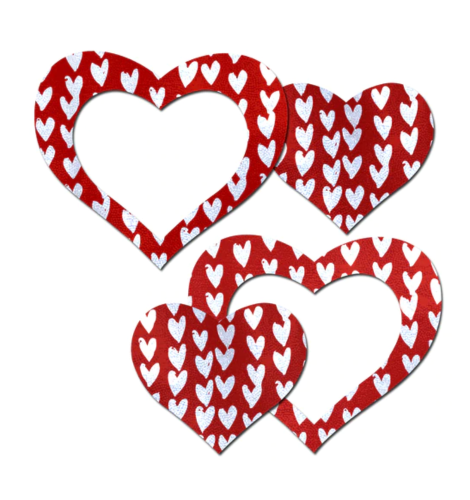 Red heart-shaped nipple pasties with a white heart pattern.