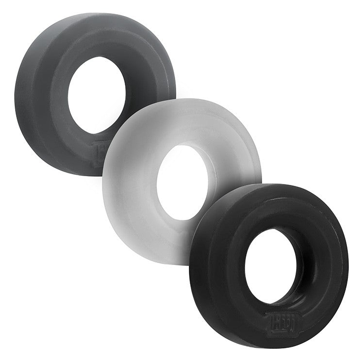 Three stretchy silicone cock rings in dark gray, light gray, and black.