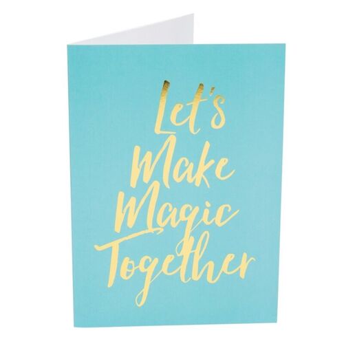 A turquoise card with gold lettering that says "Let's Make Magic Together".