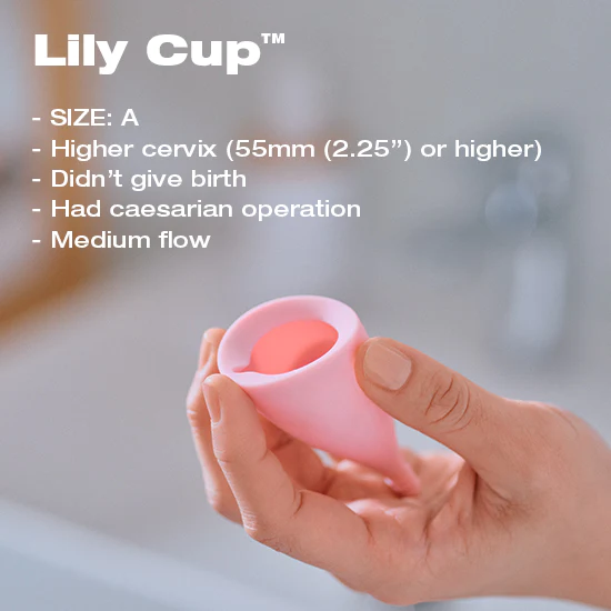 A pink Lily Cup menstrual cup is held in a hand, with text listing size A and suitability for a high cervix.