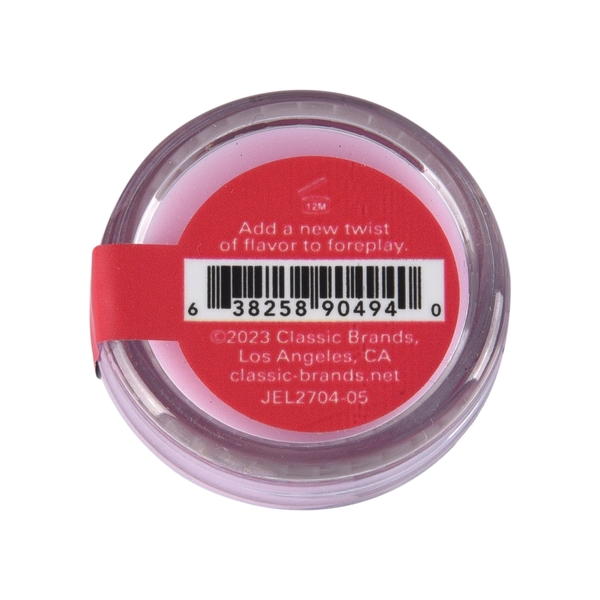 A pink nipple balm with a red label featuring a barcode and product information.