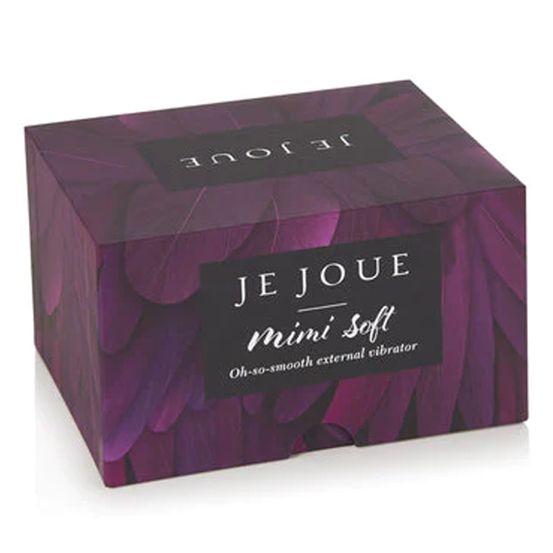 A purple box with "JE JOUE Mimi Soft" and "Oh-so-smooth external vibrator" printed on it.