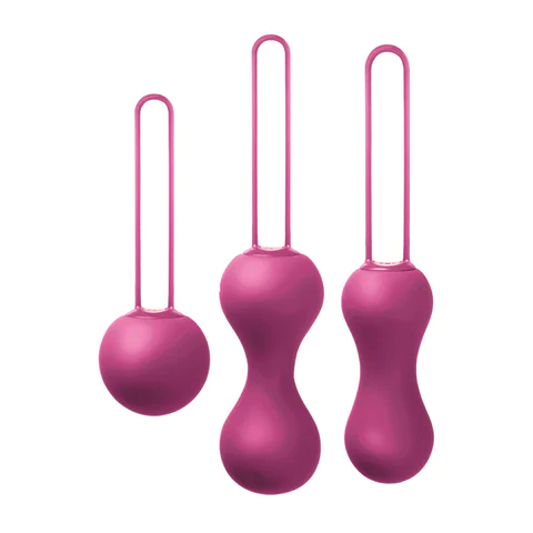 Three fuchsia silicone Kegel balls of varying sizes with retrieval loops.