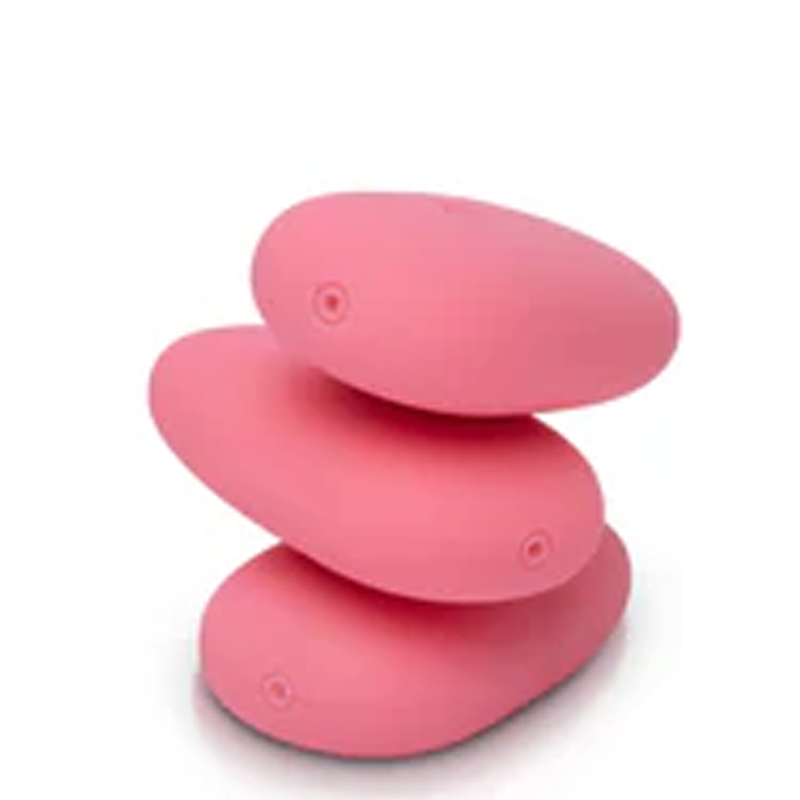 Three pink, smooth, pebble-shaped vibrators stacked on top of each other.
