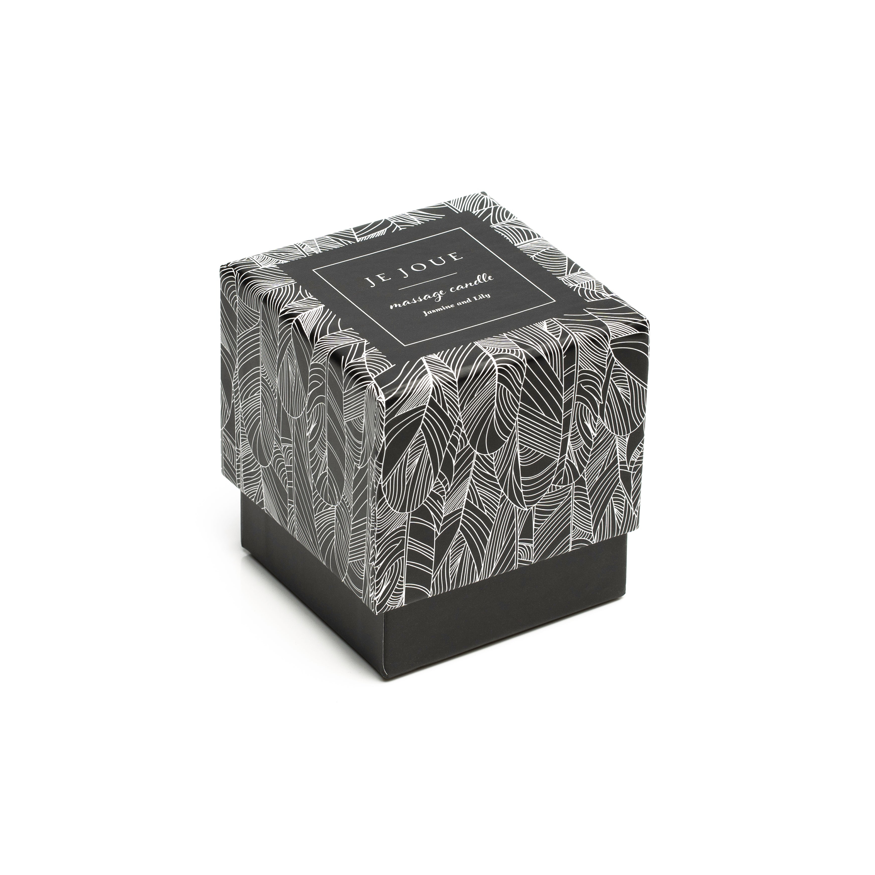 A black and white patterned box for a Je Joue massage candle.