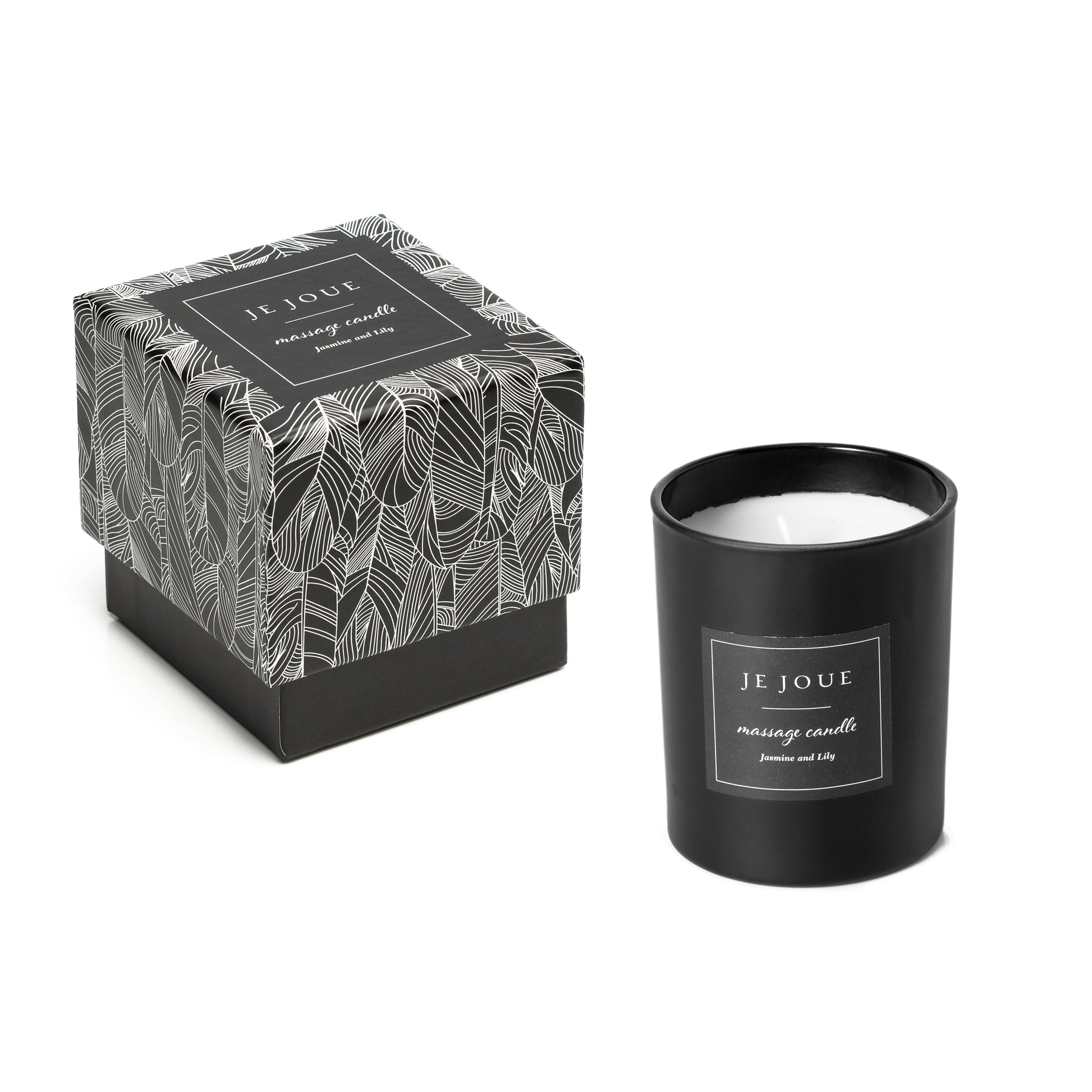 A black Je Joue massage candle with a patterned box.