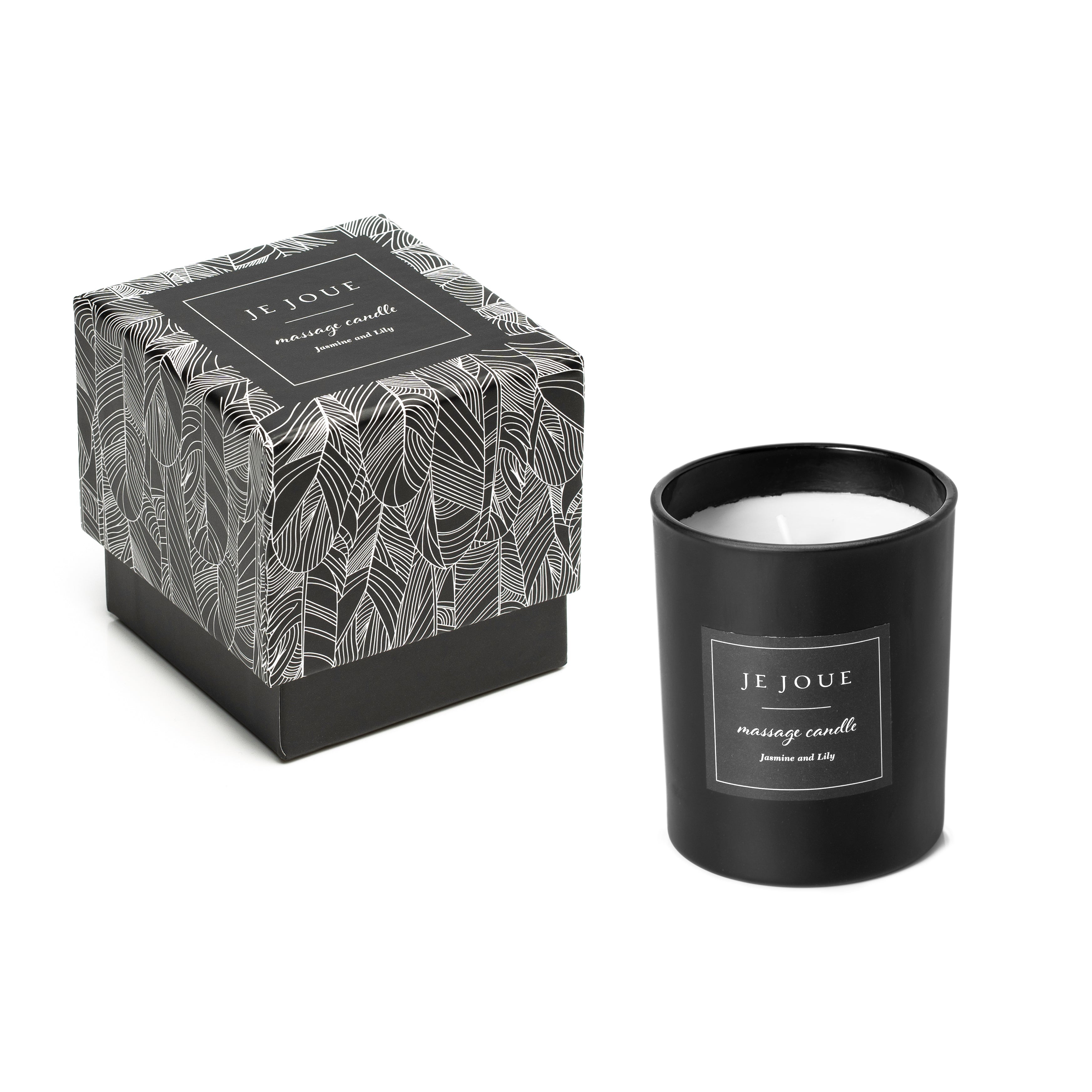 A black Je Joue massage candle with a patterned box.