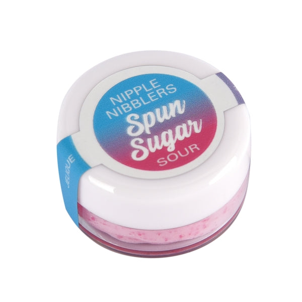 A small jar of pink spun sugar nipple balm with a blue and pink label that says "Nipple Nibblers Spun Sugar Sour".