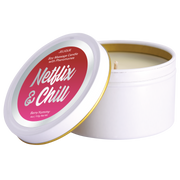 A white tin candle with a red label that says "Netflix & Chill" and "Berry Yummy".