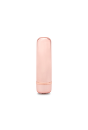 Rose gold bullet massager with a rounded top and a metallic band near the base.