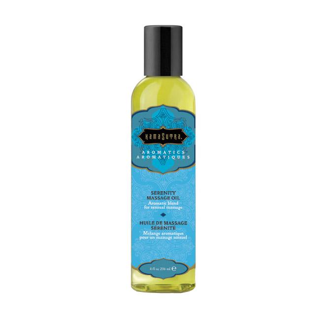 Kama Sutra Serenity massage oil in a clear bottle with a black cap.